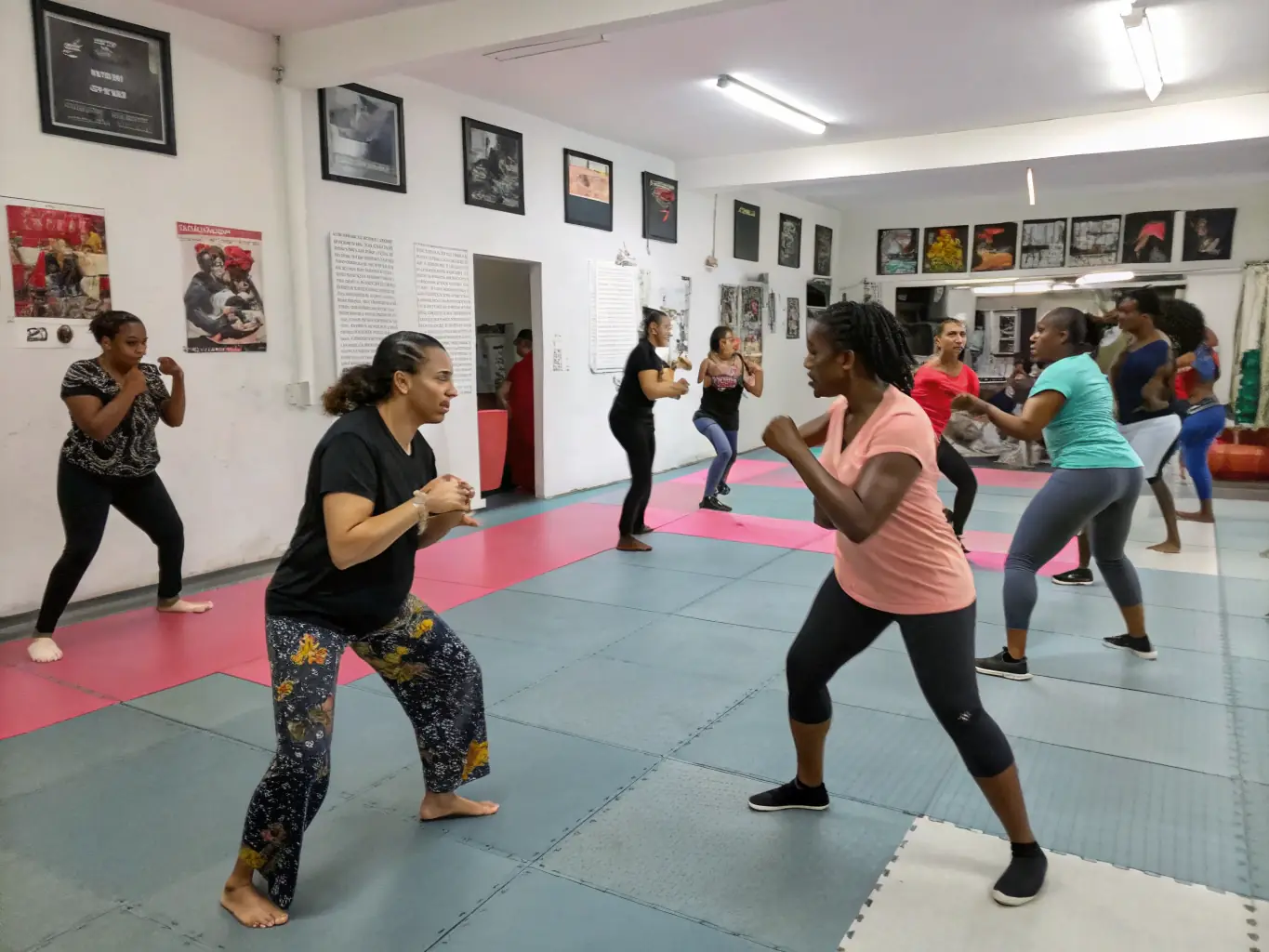 A motivational shot of female BJJ athletes training together at SKOL EMGANN, highlighting empowerment and skill development in martial arts.